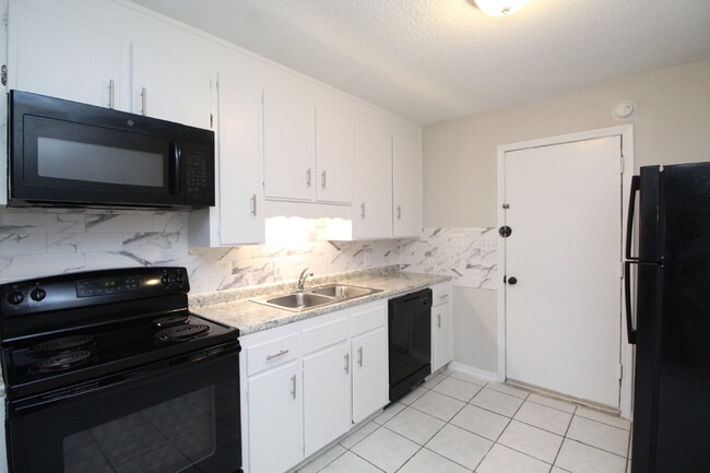 Photo - Updated 2BR/1BA Duplex Off 9 Mile Rd | All Tile Flooring | Pet-Friendly | Immediate Move-In Unit H1