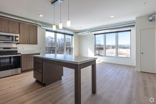 3BR, 2BA - 1,170SF - Kitchen and Living Room