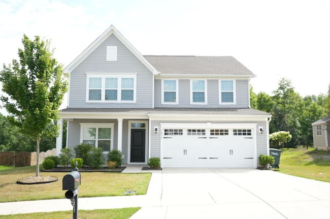 Building Photo - This wonderful home has a covered rocking ...