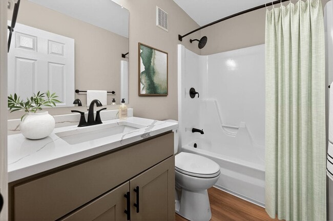 Elevate your lifestyle at Eagle Rock Apartments at Hudson. This modern bathroom features sleek finishes and ample space, perfect for relaxation. Enjoy convenient amenities and a vibrant community. Schedule your visit today! - Eagle Rock Apartments at Hudson