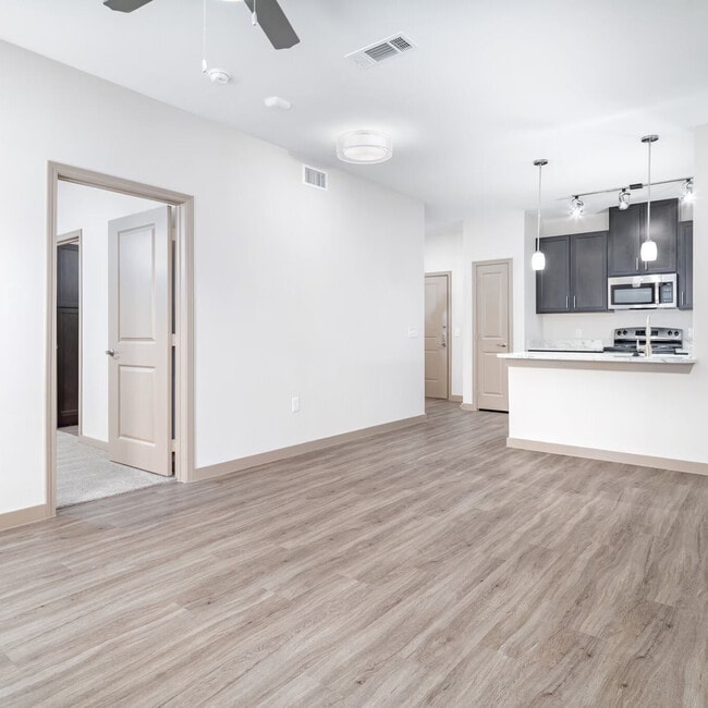 Hardwood Floors and Carpeted Bedrooms