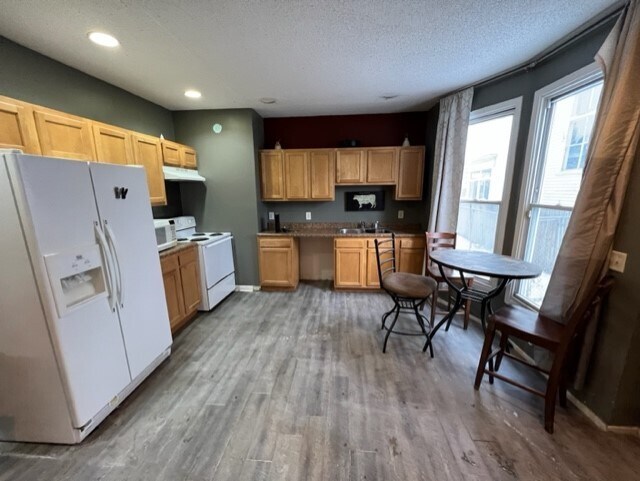 Facing Kitchen, open living area - 3040 Park Ave