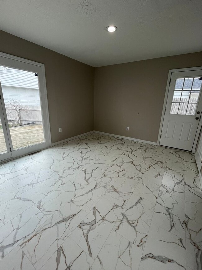 Photo - Spacious 3-Bedroom Ranch with 2-Car Garage & Oversized Fenced Backyard