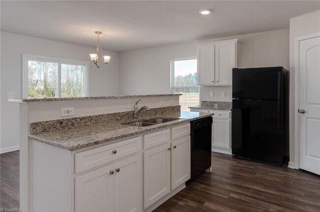 Photo - Spacious 3-Bedroom + Loft Home in Meredith Woods – Stylish, Efficient, and Perfect for Entertaining!
