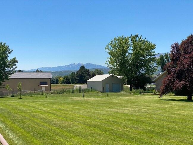 Photo - Beautiful home single level entry with out buildings and amazing landscaping - shorter term lease...