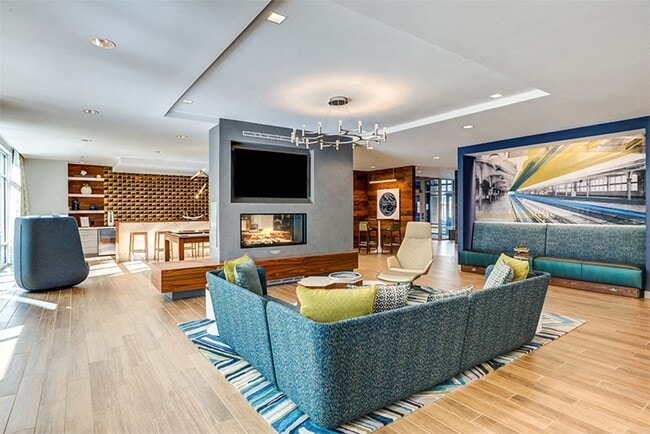 Designer clubroom with double-sided fireplace, TVs, billiards and comfortable seating