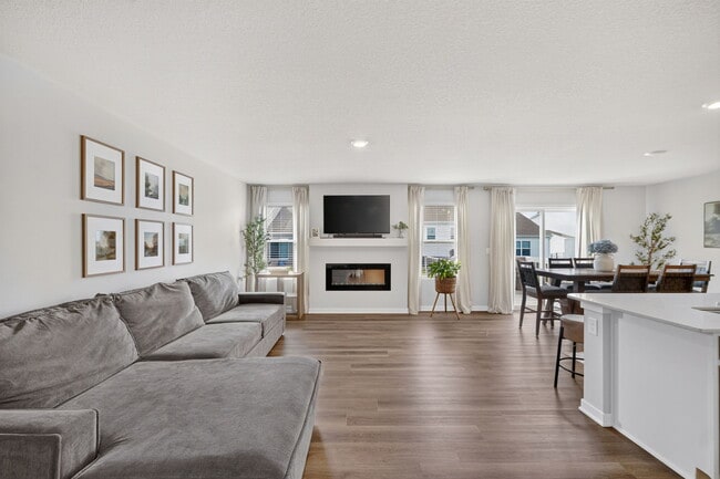 living space opens up to dining and kitchen