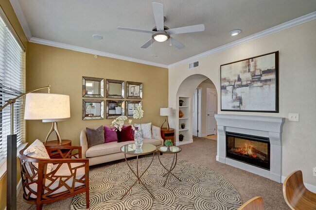 Tuscany Living Room with Fireplace and Ceiling Fan - Tuscany at Faudree