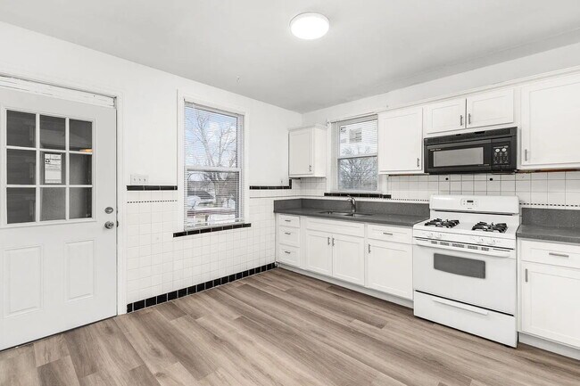 Photo - "Cozy 2-Bedroom, 1 bath Retreat with Fireplace Charm!"  One car garage, section 8 ok.