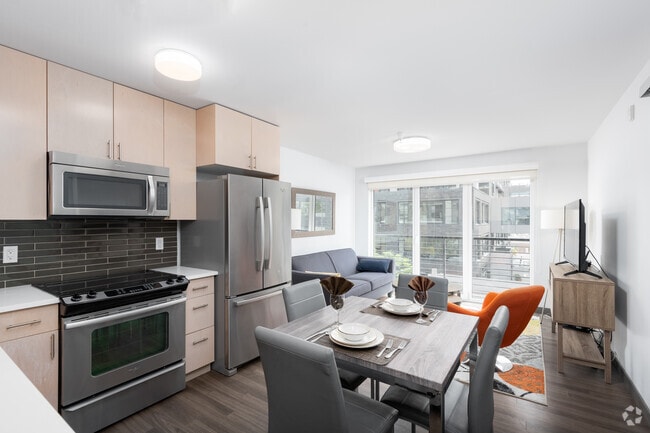 2BR, 2BA - 892SF - Kitchen and Living Room