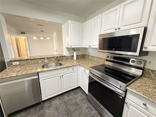Building Photo - 2711 Ocean Club Blvd Unit 203