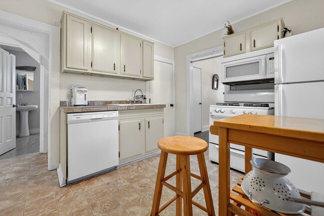 Kitchen featuring a dishwasher, Gas stove/range, microwave and fridge/freezer. - 302 Van Deusen St Unit #1