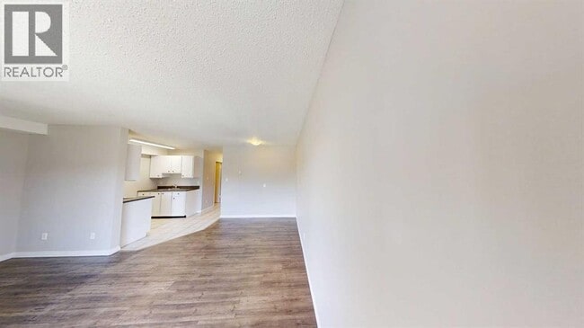 Photo - 10028-10105 105 Ave