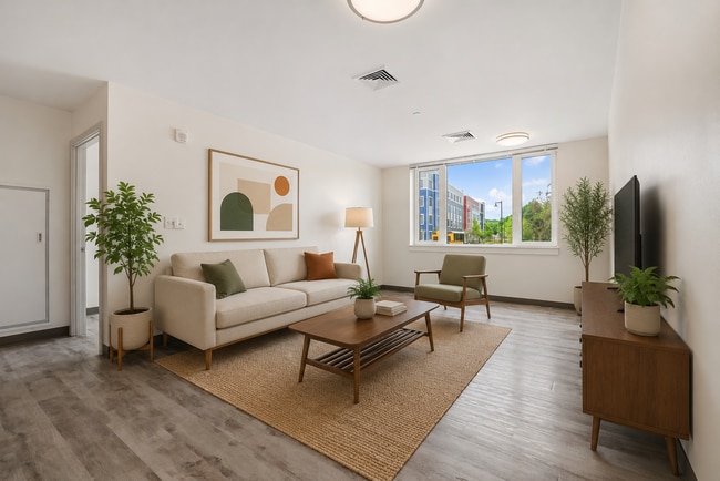 Spacious budget friendly apartment living area at The Phoenix