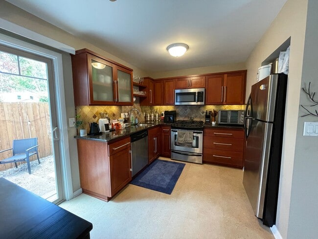 Photo - Stylish Corner Condo In Prime Location w/ Parking, Private Outdoor Space & W/D