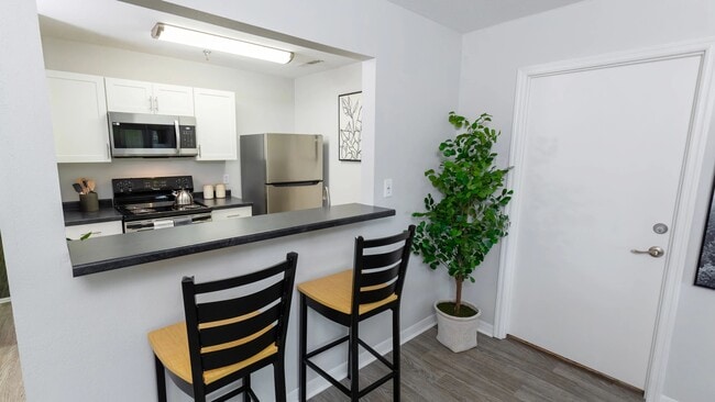 Socialize at the kitchen bar - the heart of your new home. - The LINC