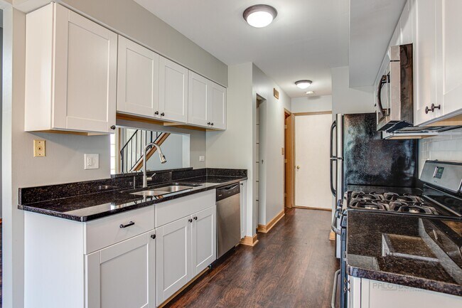kitchen with pass-through - 240 Acorn Dr