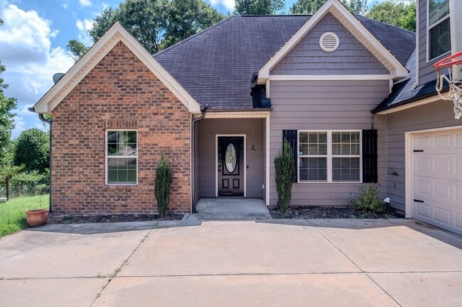 Photo - Spacious 3BR Home with Bonus Suite, Fenced Yard & 2-Car Garage