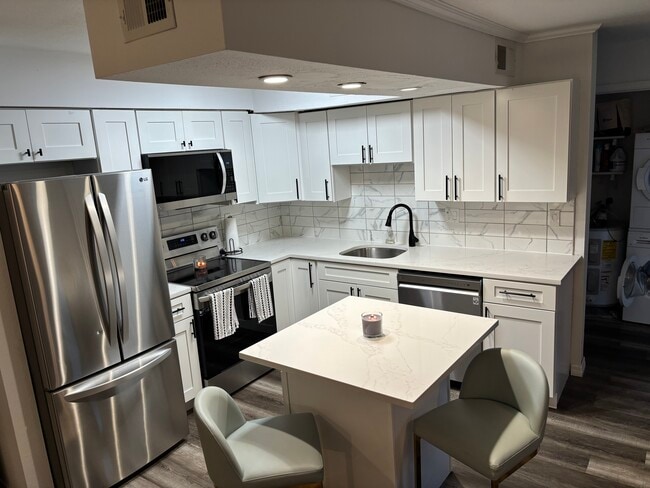 Building Photo - 9100 Dr Martin Luther King Jr St N Unit First Floor Condo