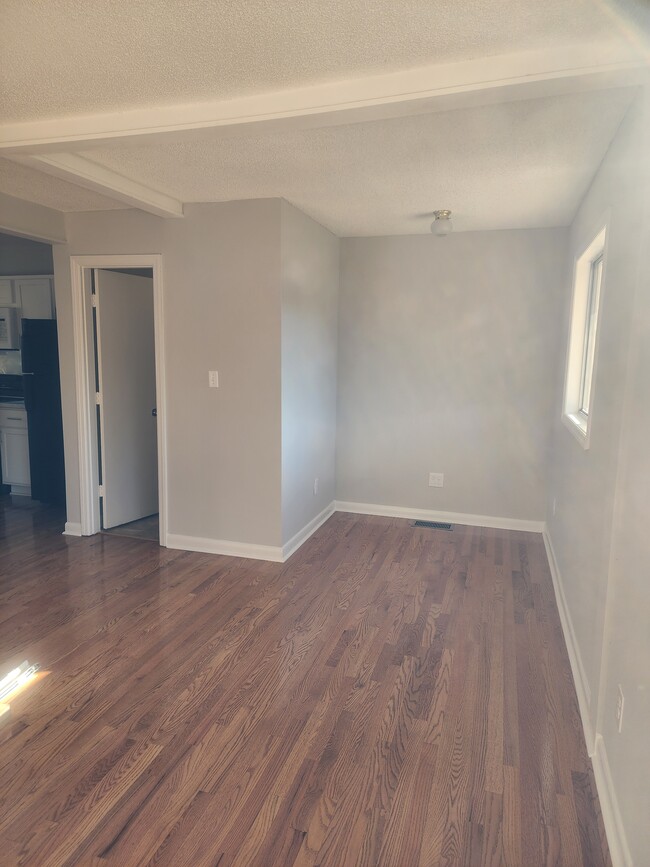 Living room and 1/2 bath - 3231 Dorian Rd