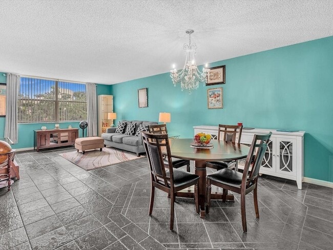 Building Photo - 6570 Royal Palm Blvd Unit 206J