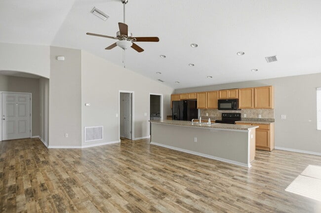 Photo - 4BR Gated Community Home with Fenced Yard, 2-Car Garage & Open Floor Plan