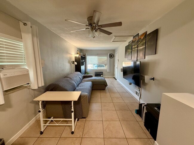 Living room is shared space. The surround sound will be hooked back up soon. - 1035 S Quitman St