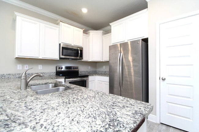 Photo - Spacious 3-Bed, 2.5-Bath Townhome Steps from Blue Wahoos Stadium & Palafox Street with Upgraded K...