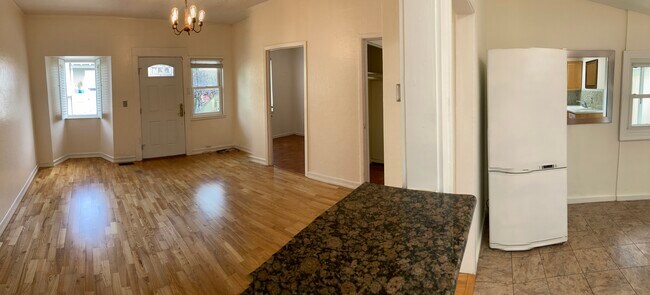 looking from kitchen breakfast bar: living room into kitchen
