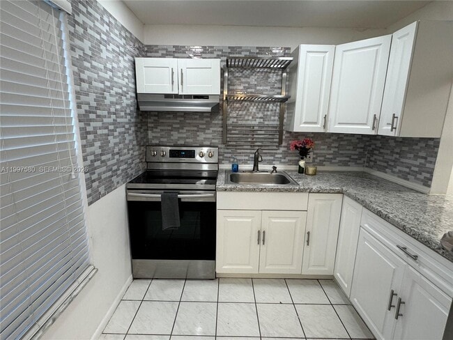 Building Photo - 6150 NW 62nd St Unit 106