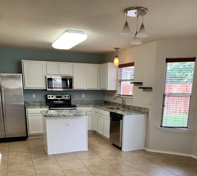 New granite counters, sink, fixtures, &amp; freshly painted cabinets - 10219 Roseangel Ln House