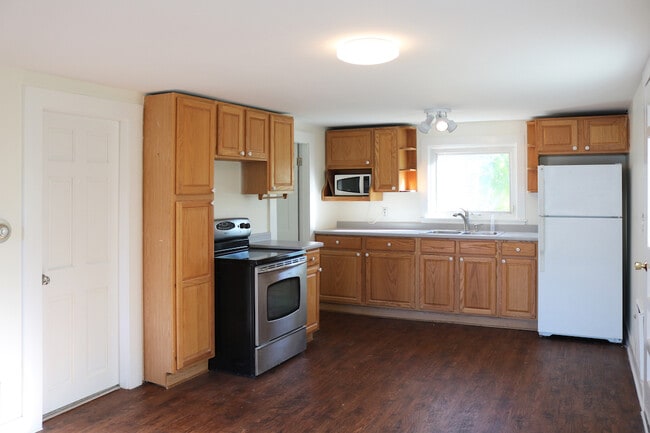 Open concept kitchen/living area with new flooring. - 34A Royal Ave Apartment Unit 34A Royal Ave