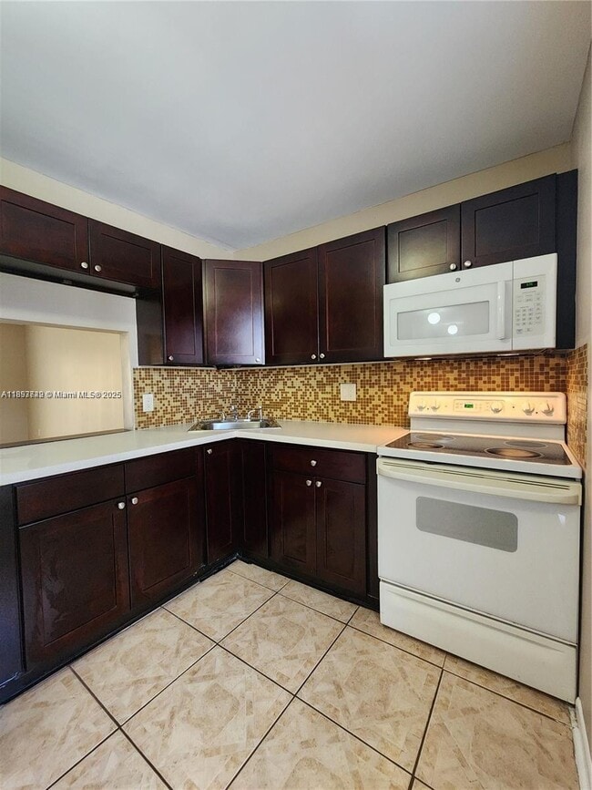Building Photo - 6020 NW 64th Ave Unit 307