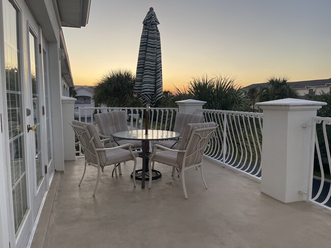 Balcony faces North for both sunset and sunrise viewing without the direct impact - 365 Royal Caribbean Ct Condo Unit Villas of Ocean Gate