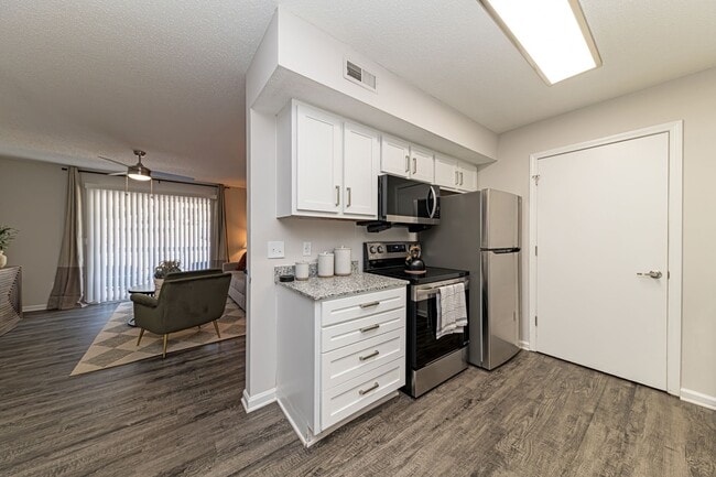 Kitchen with modern cabinetry & stainless appliances