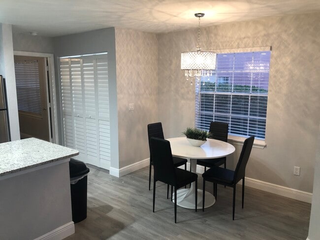 Living Room fully furnished with modern decor! - 7350 Westpointe Blvd Unit 212