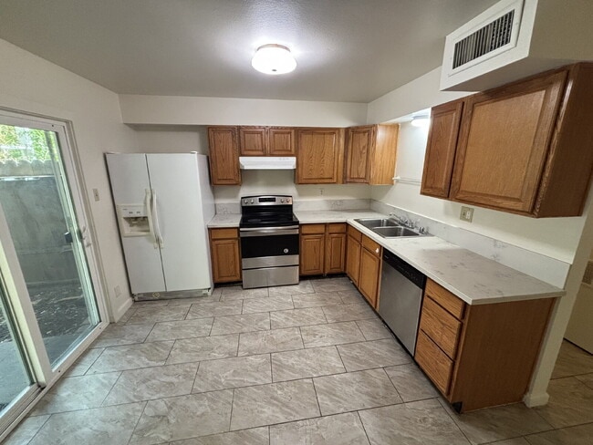 Spacious 4-Bedroom Townhome Directly Across from Greenfair Park