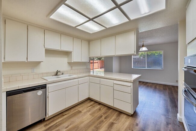 Photo - 3 Bedroom Home with Fireplace and LVP Flooring & 2-Car Garage!