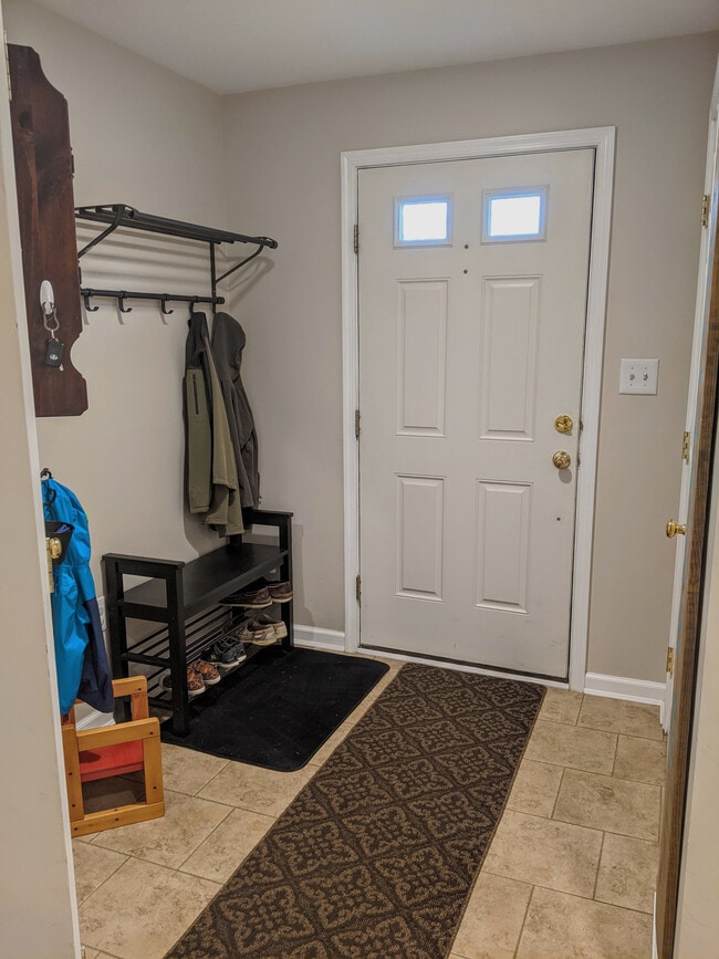 Front Entry. Two Closets - a coat closet and a generously sized storage closet with shelves. - 1466 Pangbourne Way