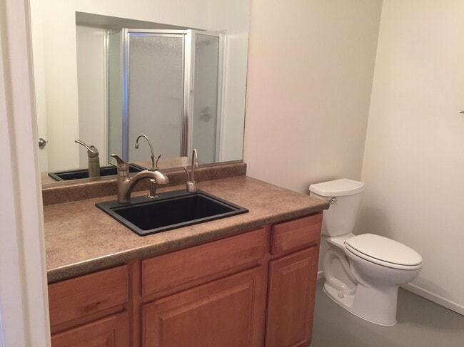 Studio bathroom (shower visible in mirror) with instant hot tap for tea. - 15135 Encanto Dr