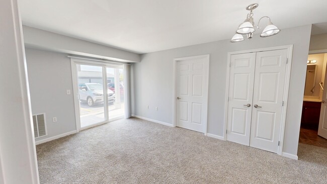 Living Room With Patio - Meyer Pointe Senior Apartments