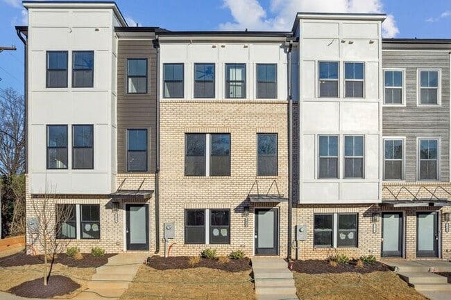 Photo - High-End 2BR Townhome | Rooftop Terrace + 2-Car Garage | 24-Unit Community