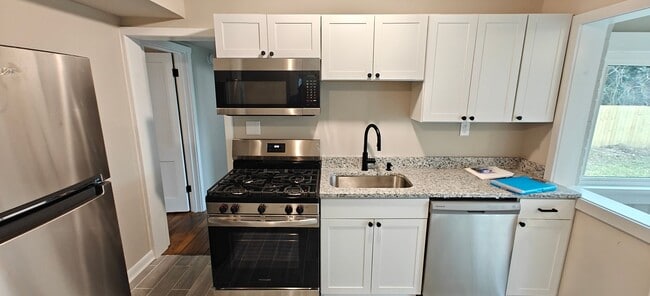 Photo - Renovated 4 bedroom cape with large fence yard