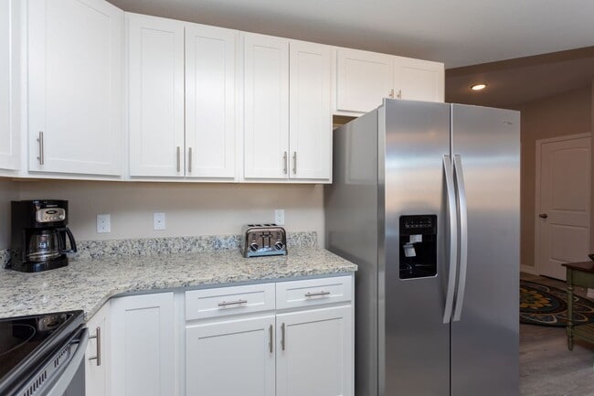 Photo - Stylish 3-Bedroom Townhome with Fireplace, Modern Kitchen & Spacious Layout!
