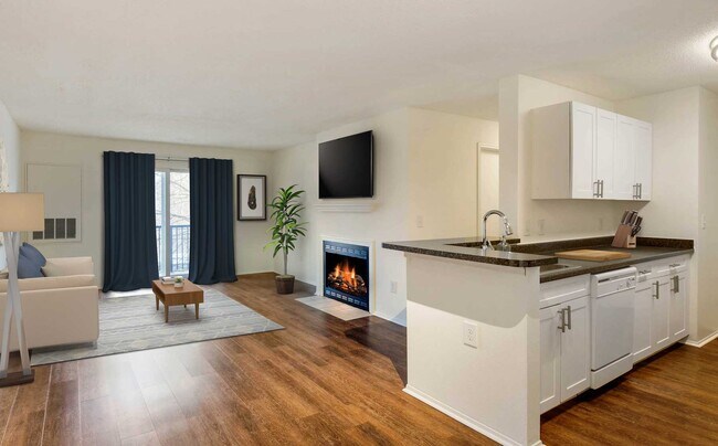 Classic Package kitchen, living, and dining areas with hard surface plank flooring
