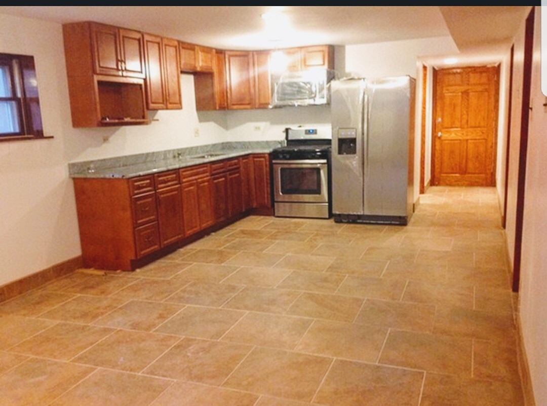 Kitchen with stainless steel appliances & Granite countertop - 2443 N Newcastle Ave (Chicago, IL)