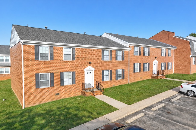 Two-story red brick apartment buildings