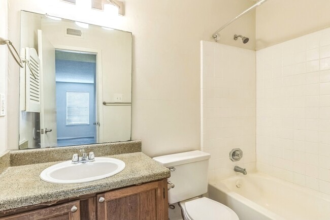 Modern bathrooms feature a full tub and shower combination with quality fixtures, professionally operated by Highlands Vista Group.