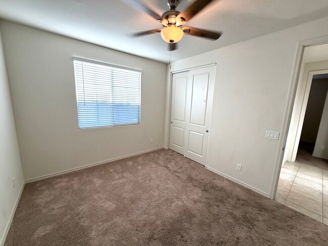 Beautiful 4BR/3BA single-story home in Harvest Queen Creek! Built in 2021 with 2,306 SF, den, che...