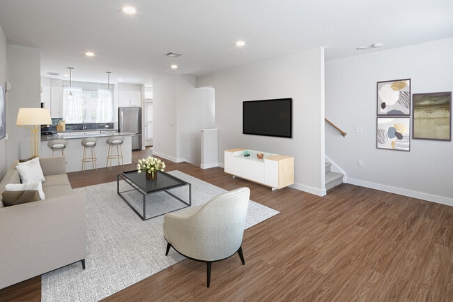 Phase II Renovated Package I townhome living and dining area with hard surface flooring